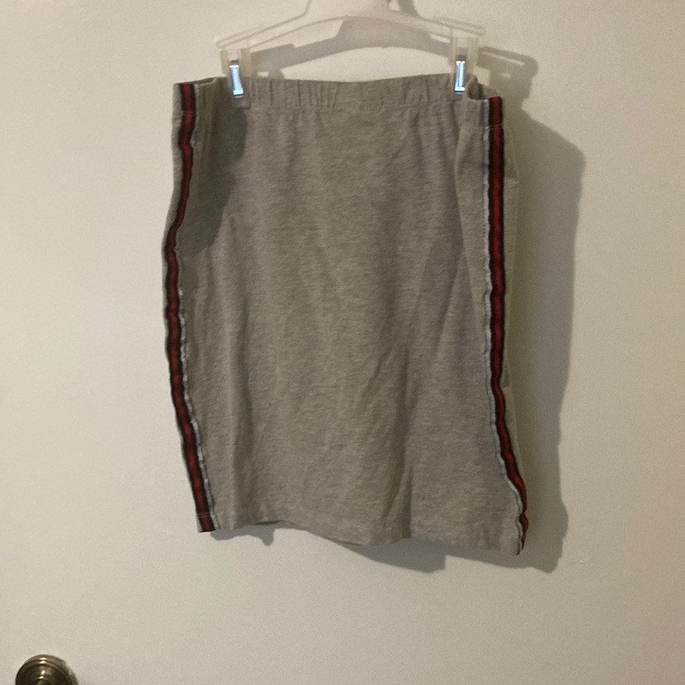 Grey mini skirt with stripes on the side.